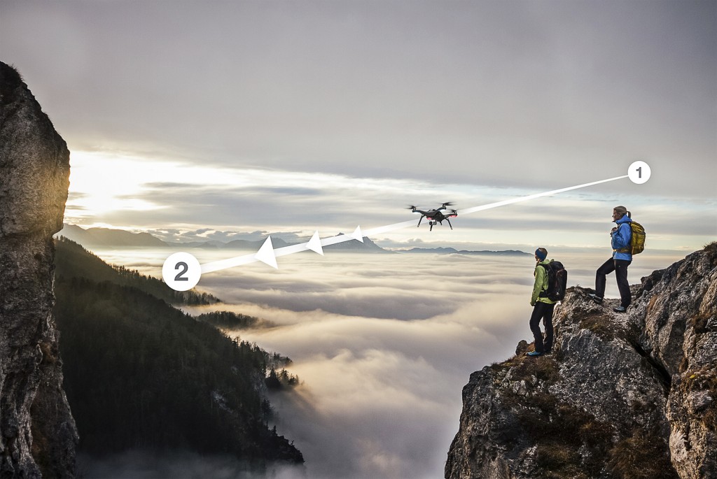 two female hiker above the sea of fog on top of a mountain at sunset